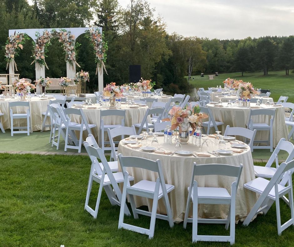 image of amira garden set up with an altar and tables with chairs for a wedding